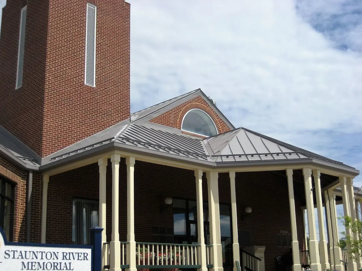 Skilled roofing craftsmen working on a residential roof in Little River-Academy